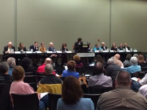 candidates stretch across the front of the room